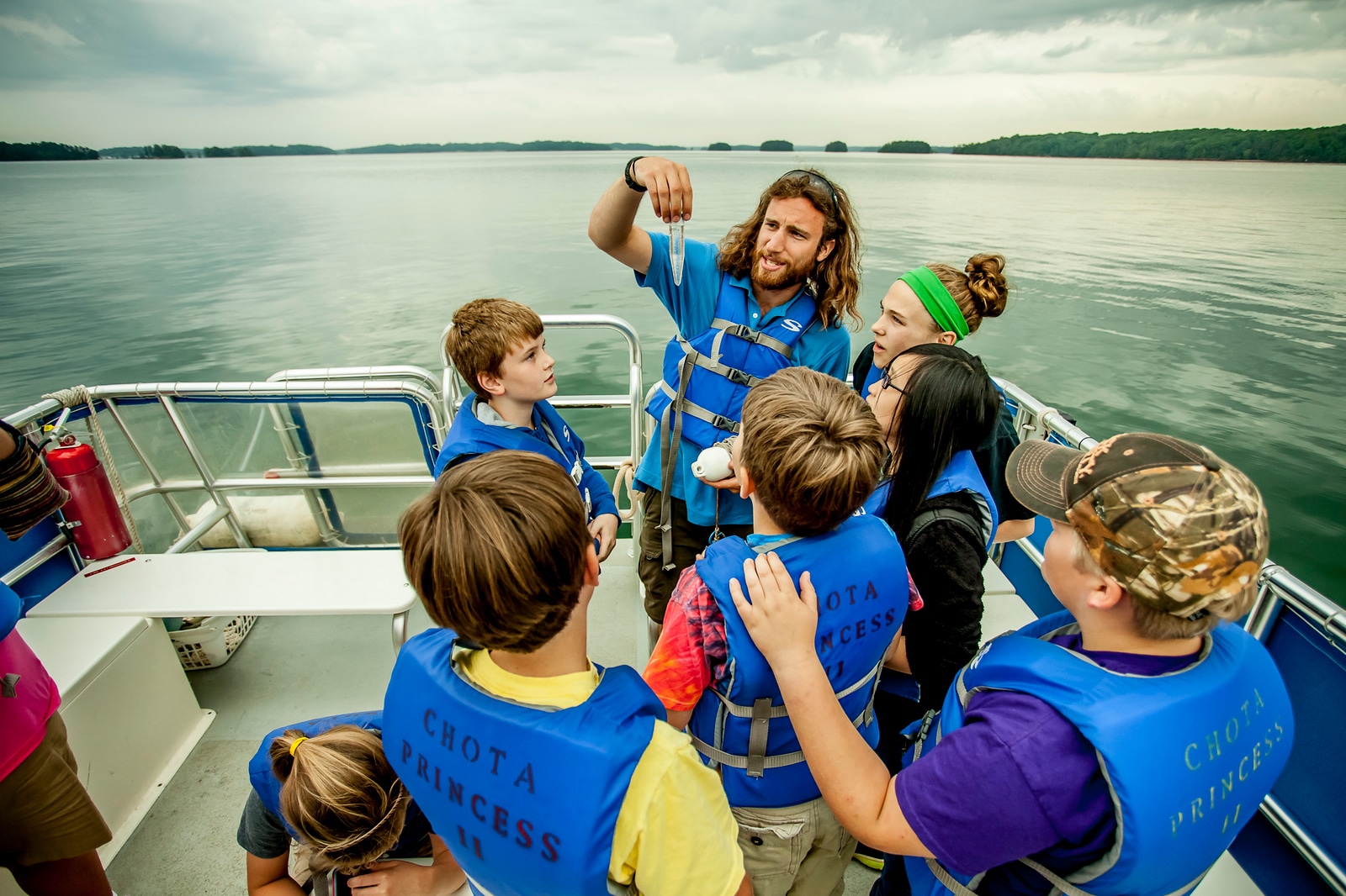 students aboard Chattahoochee Riverkeeper Floating Classroom doing water quality testing on Lake Lanier in Georgia
