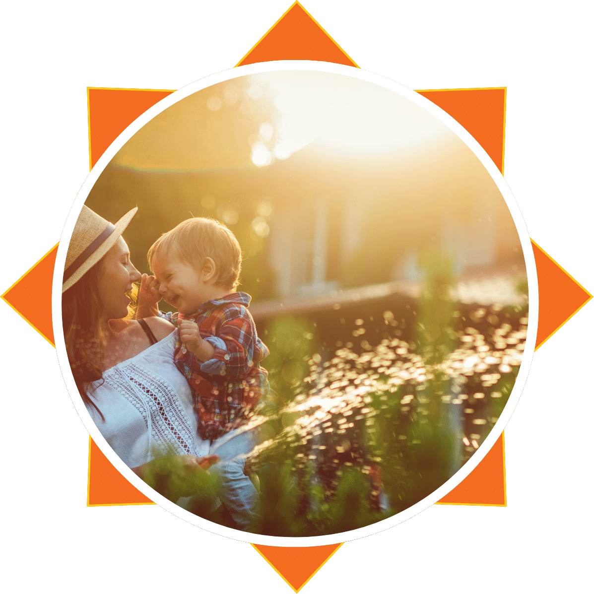 Woman holding young child in a field