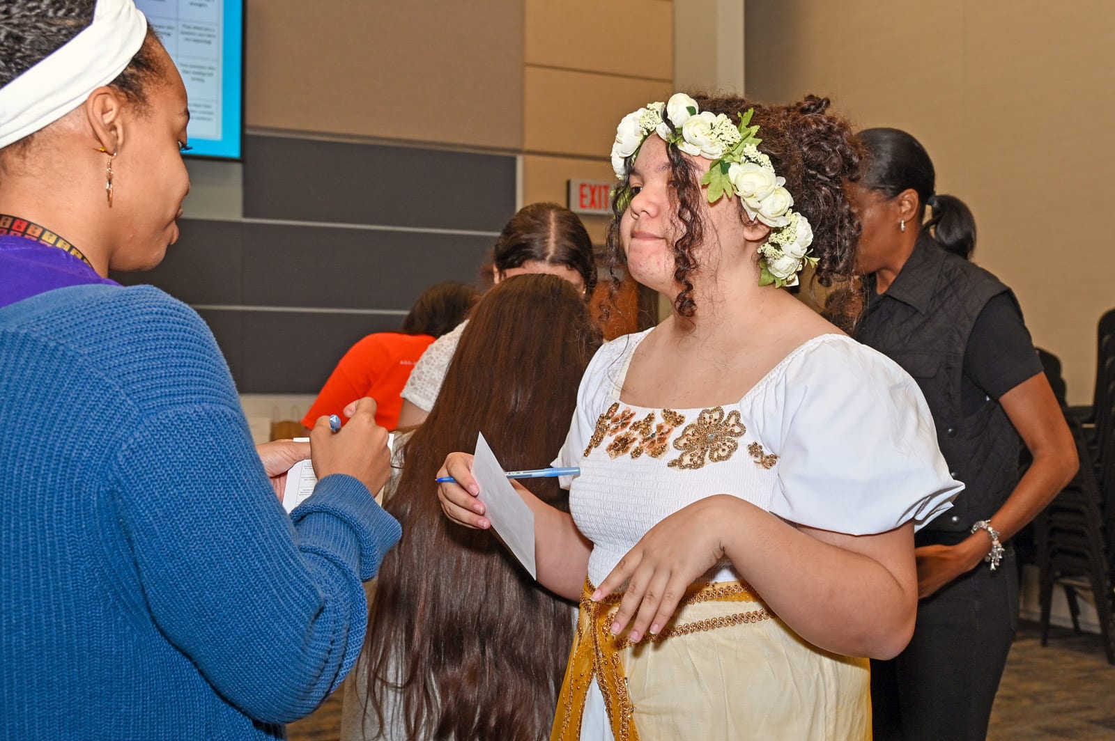 8th grader Natalie from Clear Creek Intermediate participates in the Networking Bingo activity with Humble Middle School's Ms. Meagan Holmes.