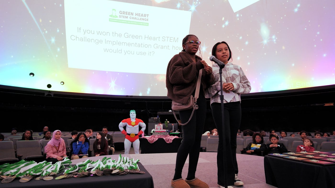 Student finalists answer questions in front of the judge's panel at the Metro Atlanta 2025 Green Heart STEM Challenge Finale.