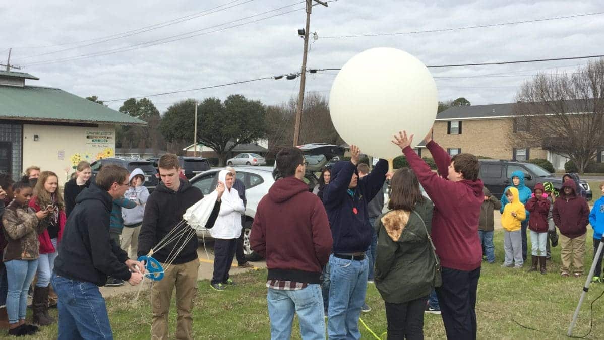 Students at LearningTECH/Quest School launching weather balloon