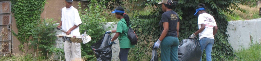 Young students collecting trash