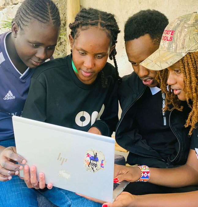 Kevin Lekishon is pictured here (2nd from right) leading a group discussion during his WATER Meetup to discuss solutions that will help reduce pollution in the River Enkare Narok.