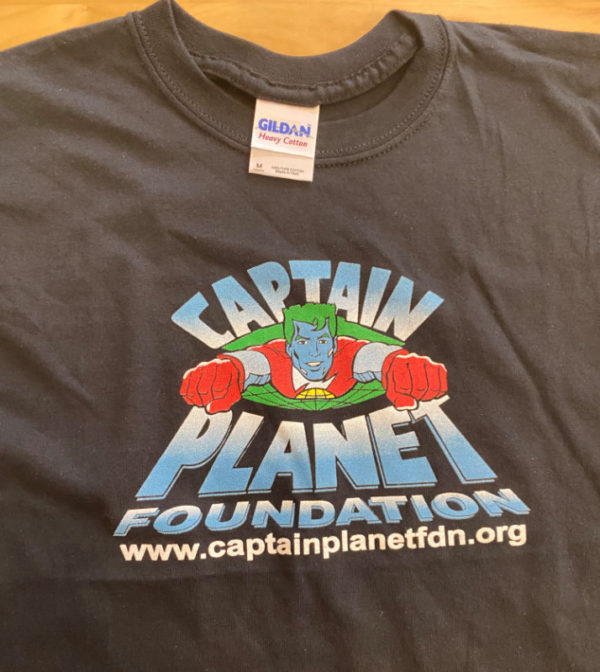 A black cotton t-shirt with the vintage logo of Captain Planet Foundation