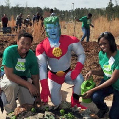 Students with Captain Planet in a school garden