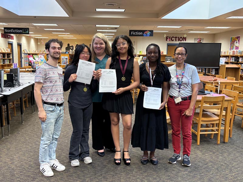 BMS Green Victory Team members display their revised plan worksheets