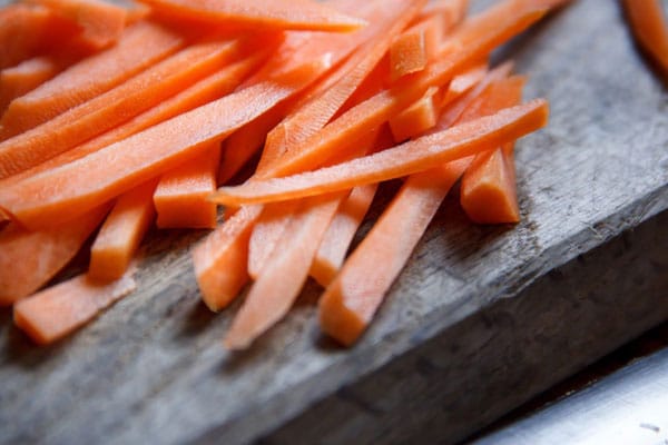 Sliced carrots sitting on a table