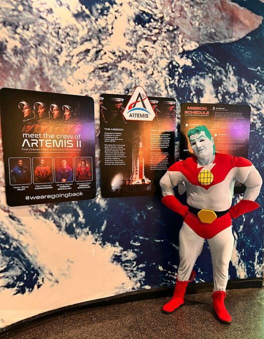 Captain Planet stands with one of Fernbank Science Center’s newest exhibits