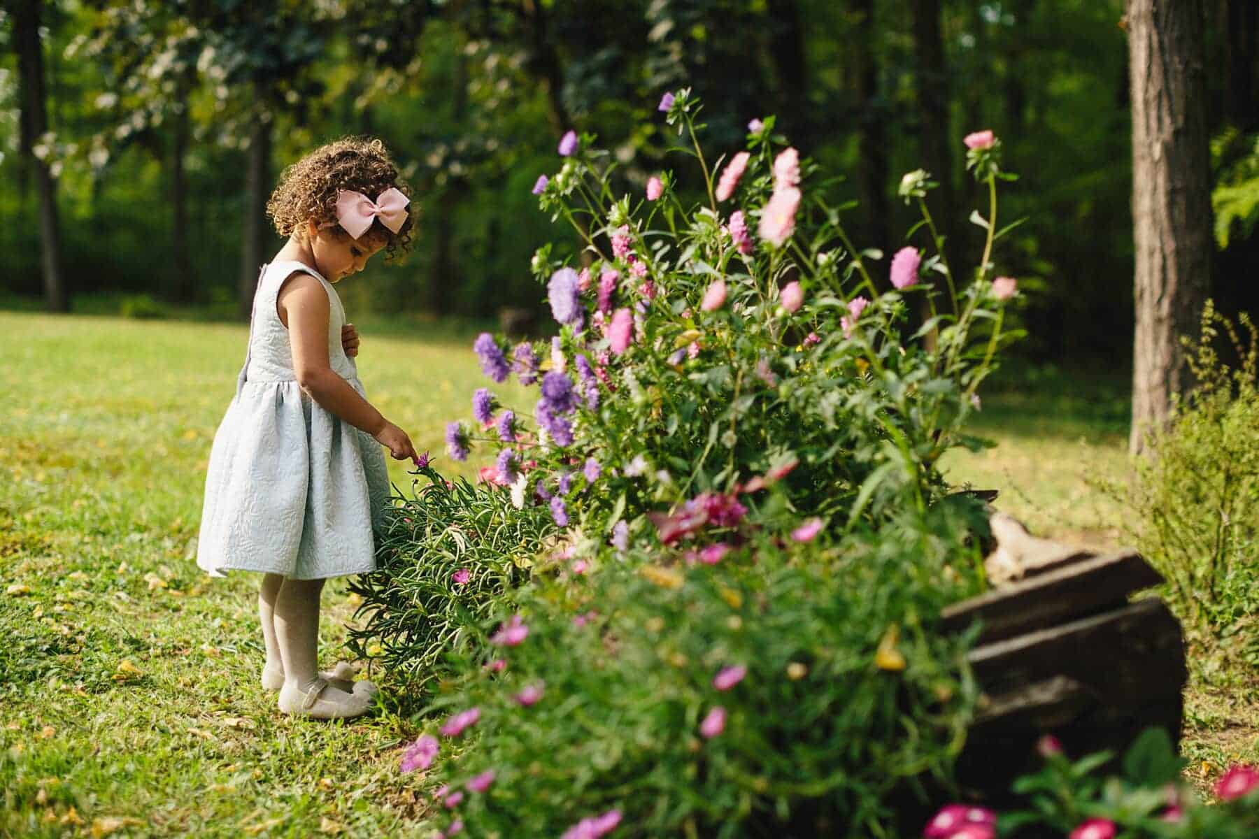 little girl watering her plants