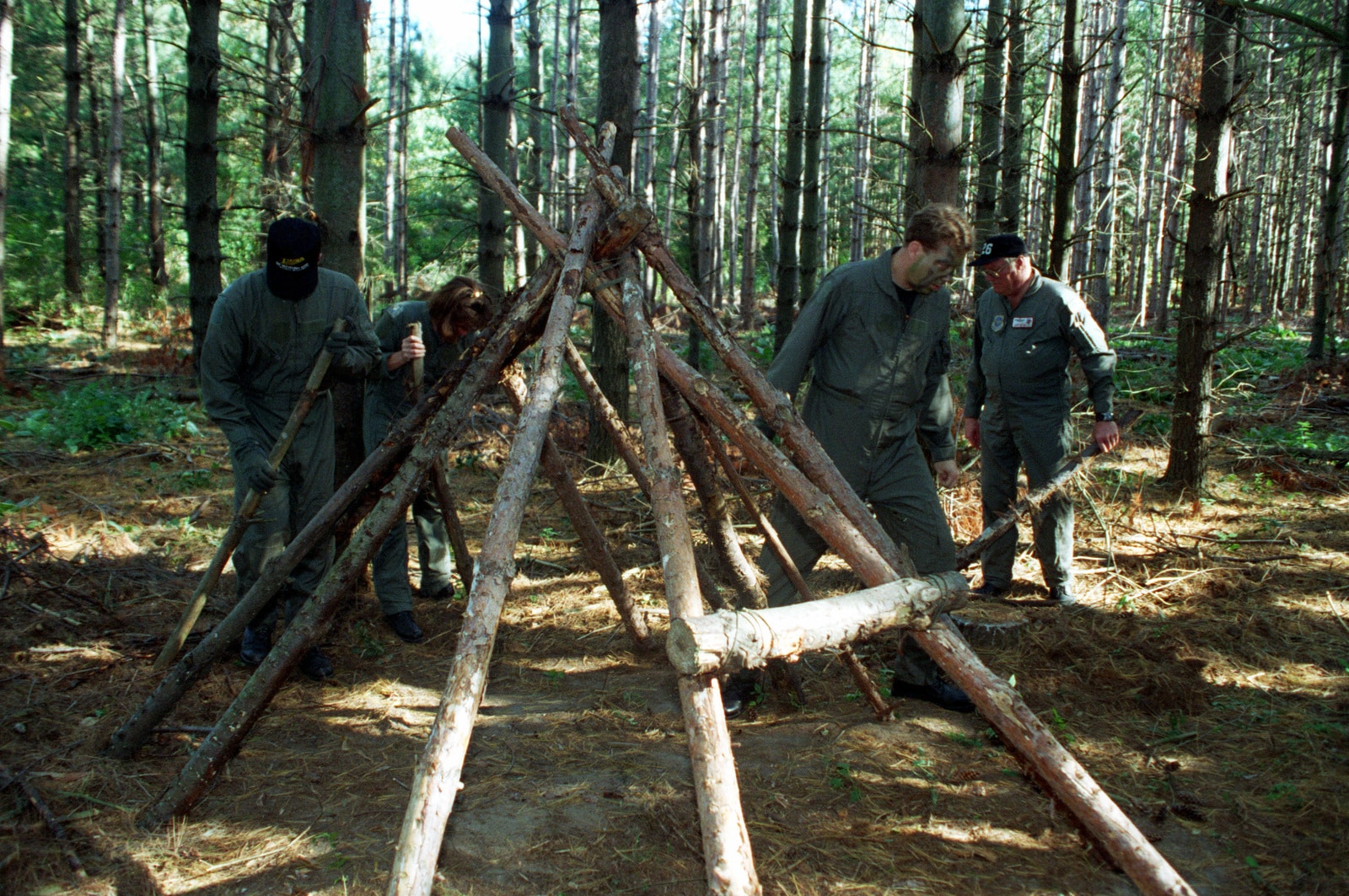 men learning survival techniques