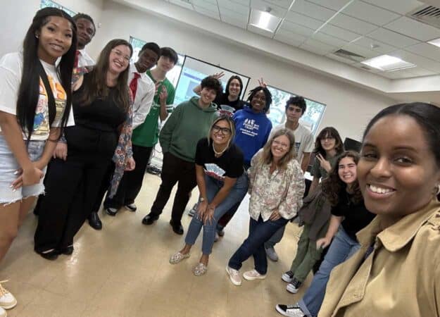 Attendees and Team Planet Take a Photo with Yadira Diaz
