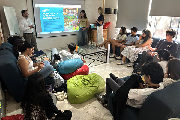 Becca and Natalia present the Planeteer Alliance program to EPI’s club youth.