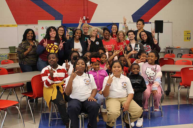 Emma Hutchison’s STEM Ambassador student leaders pose in front of volunteers and staff from Delta Air Lines, Captain Planet Foundation, Emma Hutchison Elementary, and Atlanta Public Schools.