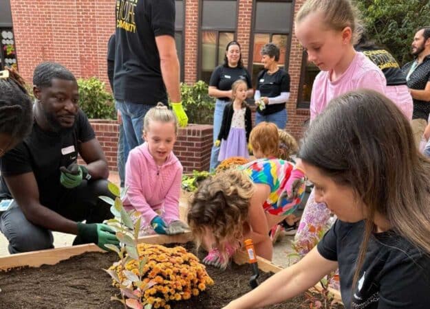 Project Learning Garden Students and a Garden Bed
